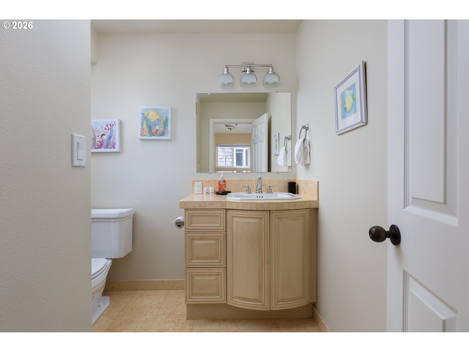3087 South Hemlock Street Cannon Beach, OR 97110 - Photo 27 of 48 a bathroom with a sink mirror and toilet