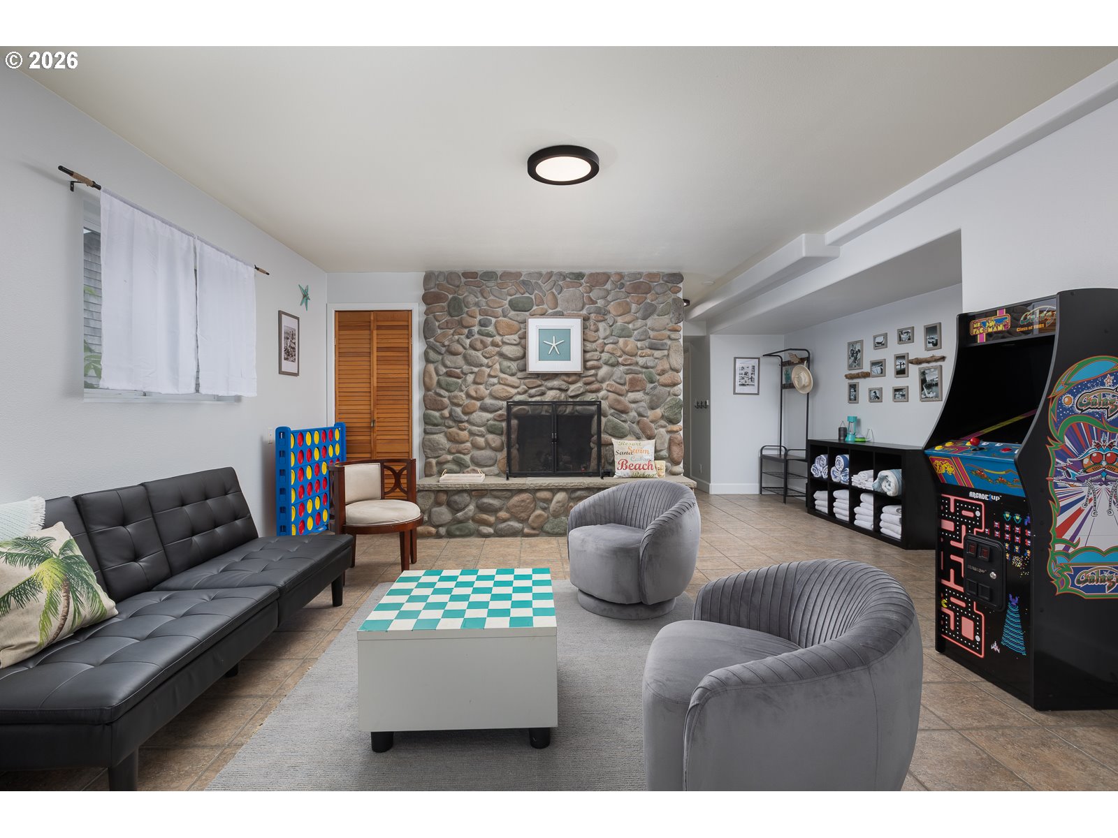 3087 South Hemlock Street Cannon Beach, OR 97110 - Photo 29 of 48 a living room with furniture and a fireplace