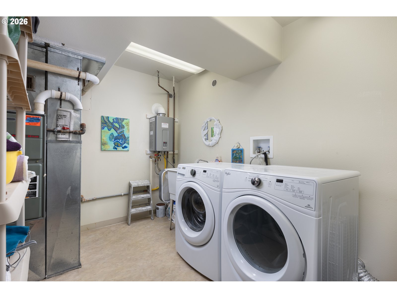 3087 South Hemlock Street Cannon Beach, OR 97110 - Photo 31 of 48 a utility room with dryer and washer