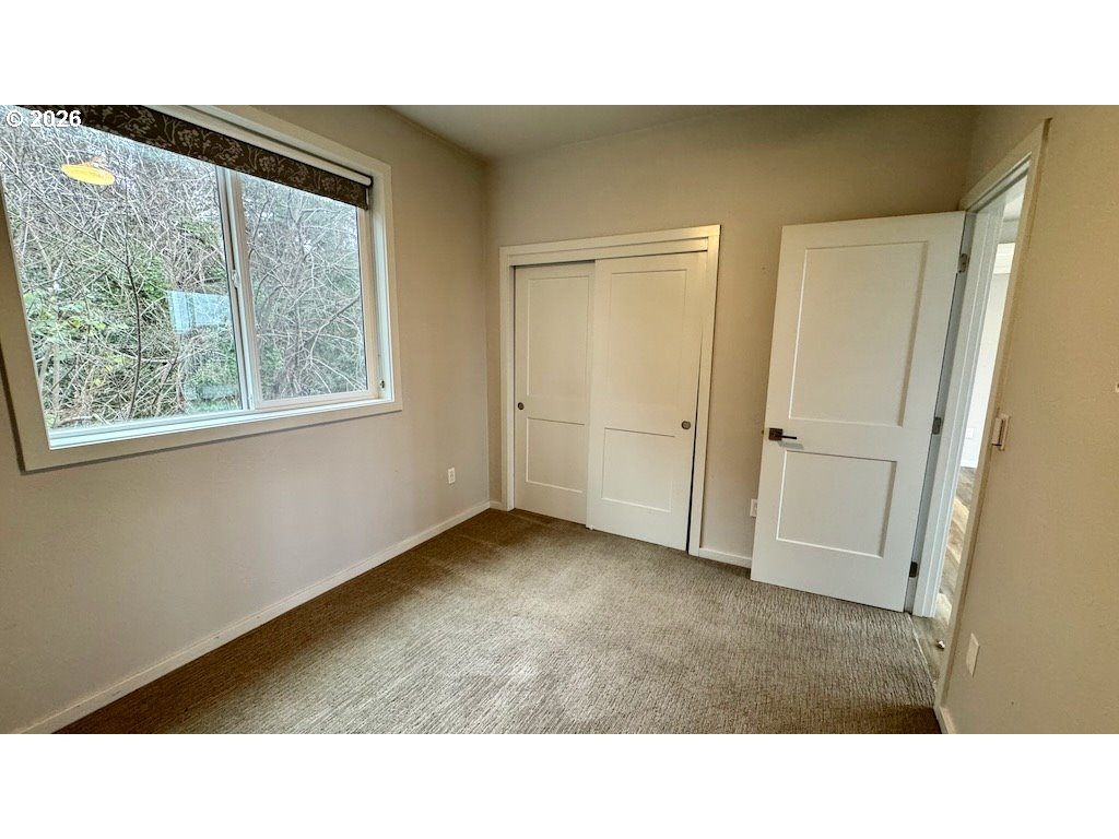 3087 South Hemlock Street Cannon Beach, OR 97110 - Photo 36 of 48 a black and white photo of a living room