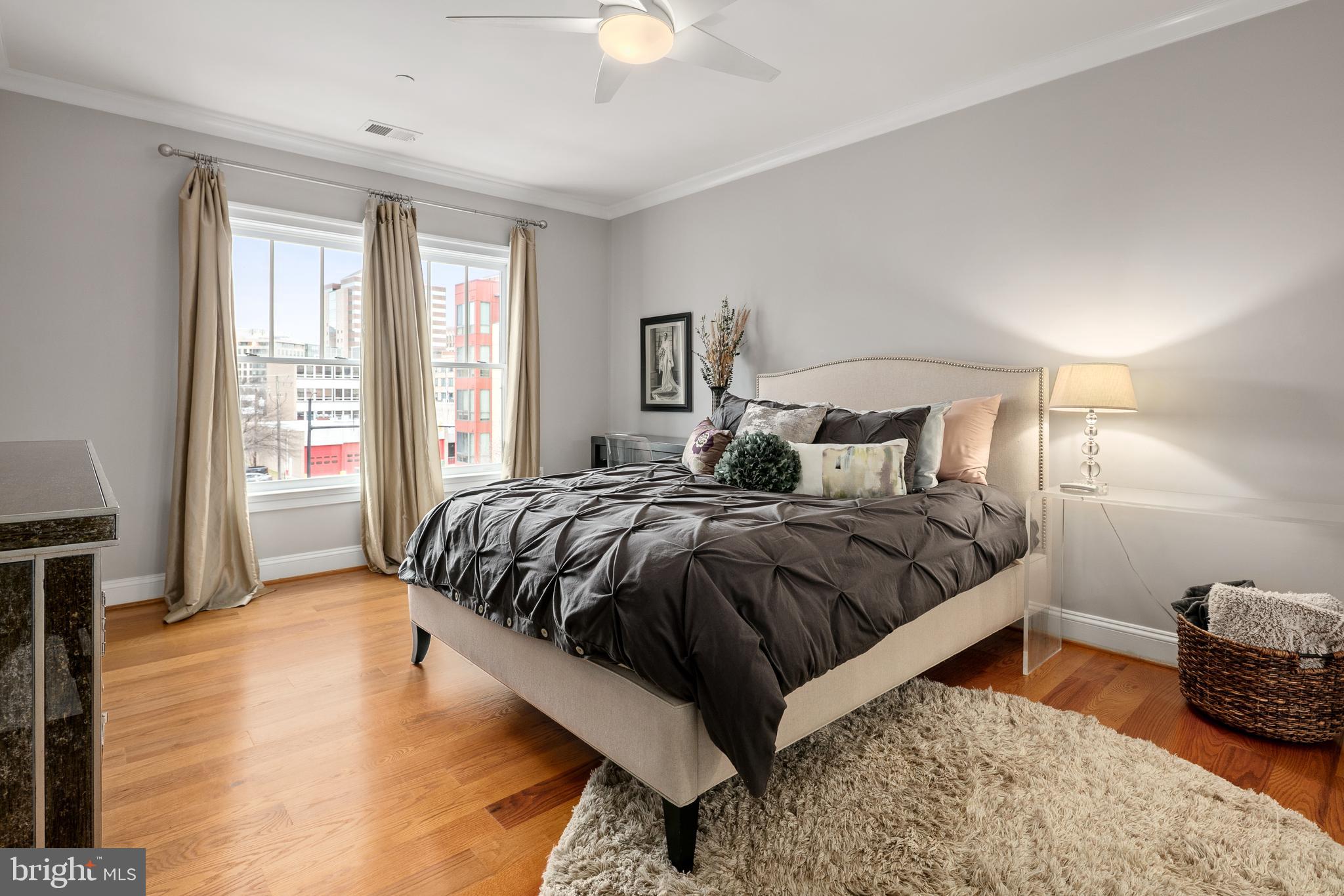 3131 9th Road North, Unit 44 Arlington, VA 22201 - Photo 15 of 33 a bedroom with a bed and wooden floor