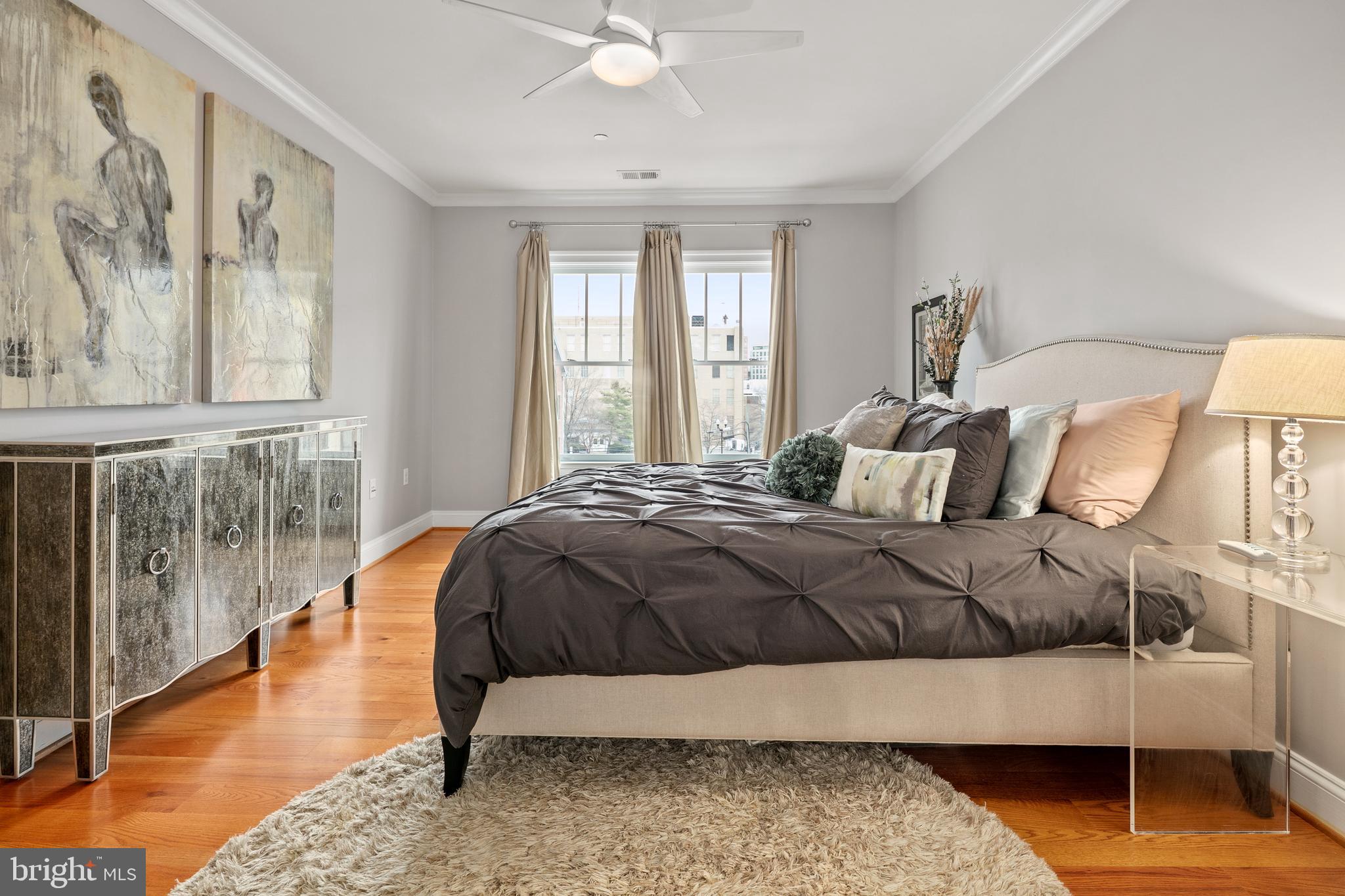 3131 9th Road North, Unit 44 Arlington, VA 22201 - Photo 16 of 33 a bedroom with a bed and wooden floor