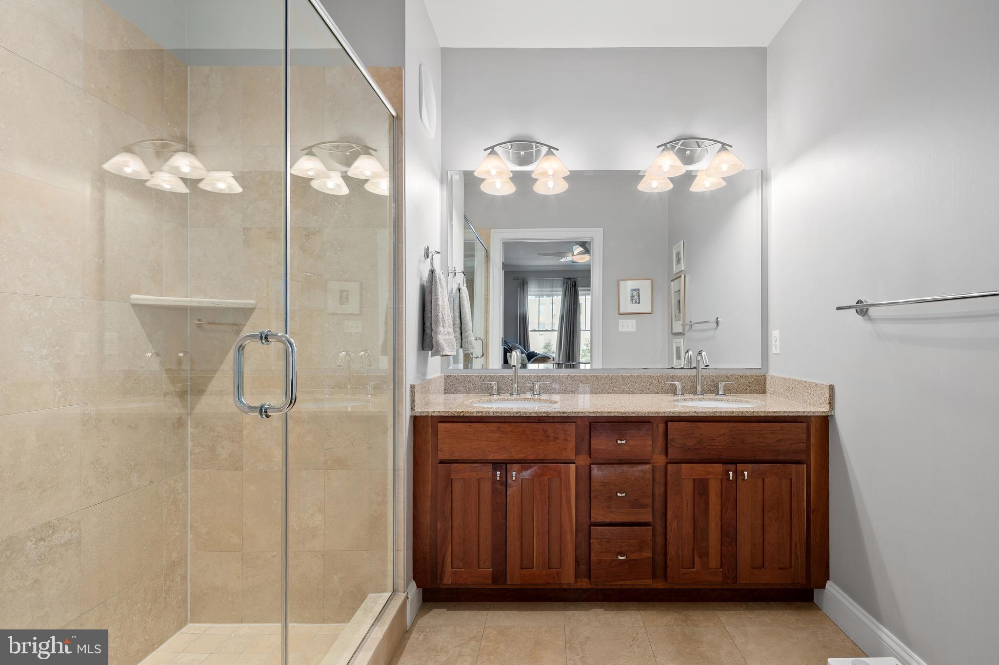 3131 9th Road North, Unit 44 Arlington, VA 22201 - Photo 18 of 33 a bathroom with a double vanity sink and a mirror