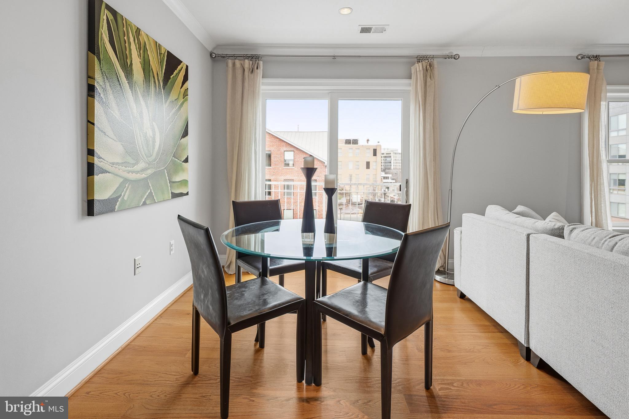 3131 9th Road North, Unit 44 Arlington, VA 22201 - Photo 9 of 33 a view of a dining room with furniture and wooden floor