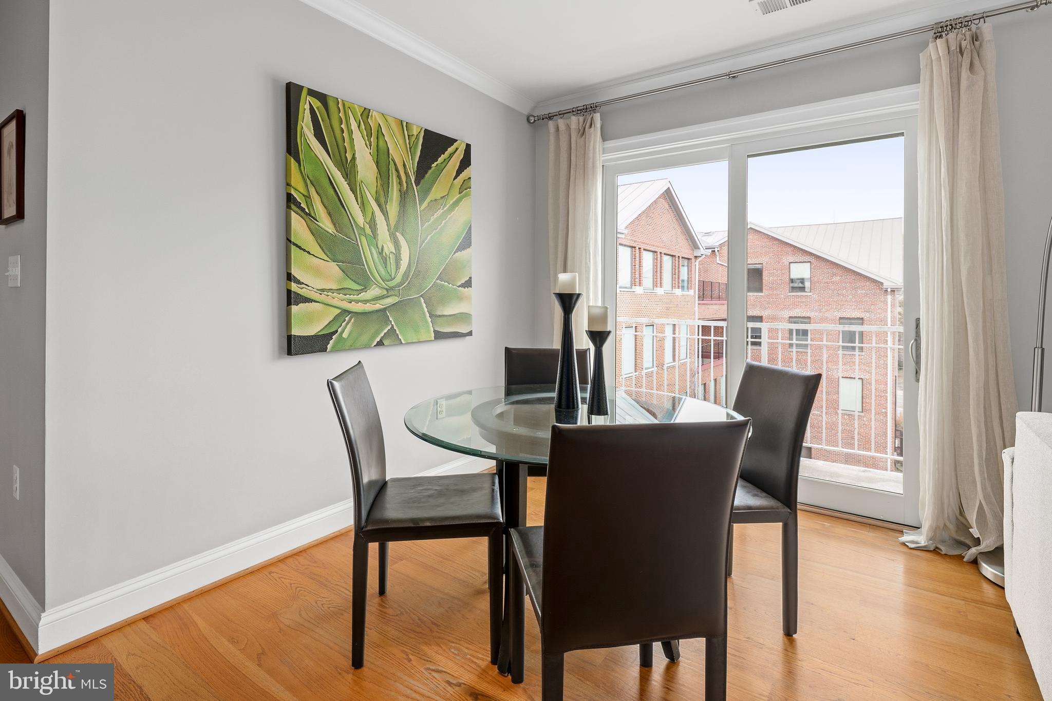 3131 9th Road North, Unit 44 Arlington, VA 22201 - Photo 10 of 33 a view of a dining room with furniture a chandelier and wooden floor