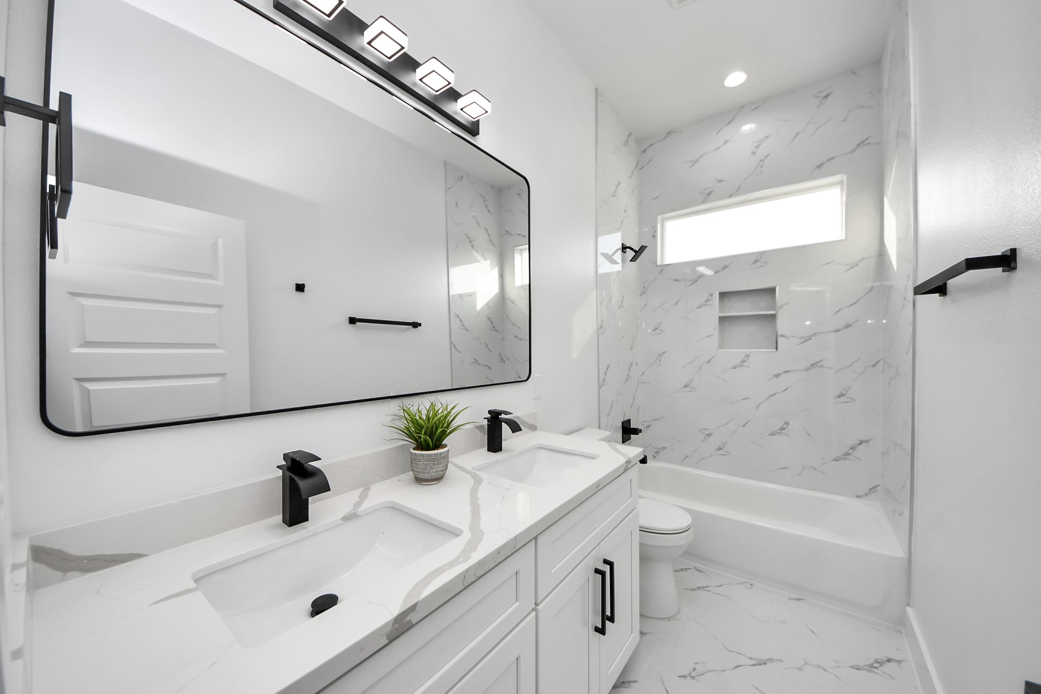 8533 Amadwe Street, Unit B Houston, TX 77051 - Photo 31 of 36 Secondary bathroom featuring double sinks