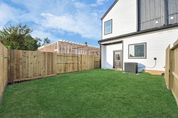 a view of a back yard of the house