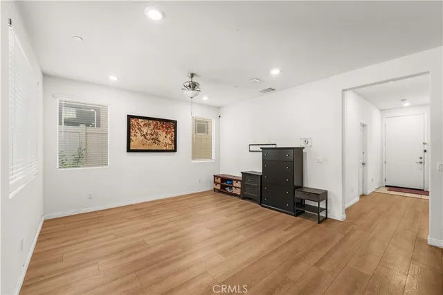 a view of a livingroom with furniture and a window