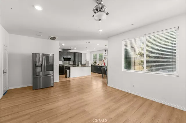 a view of a kitchen with a stove cabinets and wooden floor