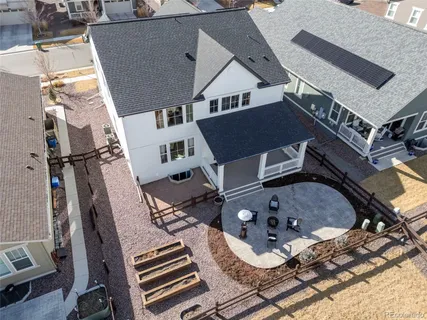 a view of a house with backyard and a porch