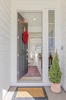 a living room with fireplace furniture and a flat screen tv