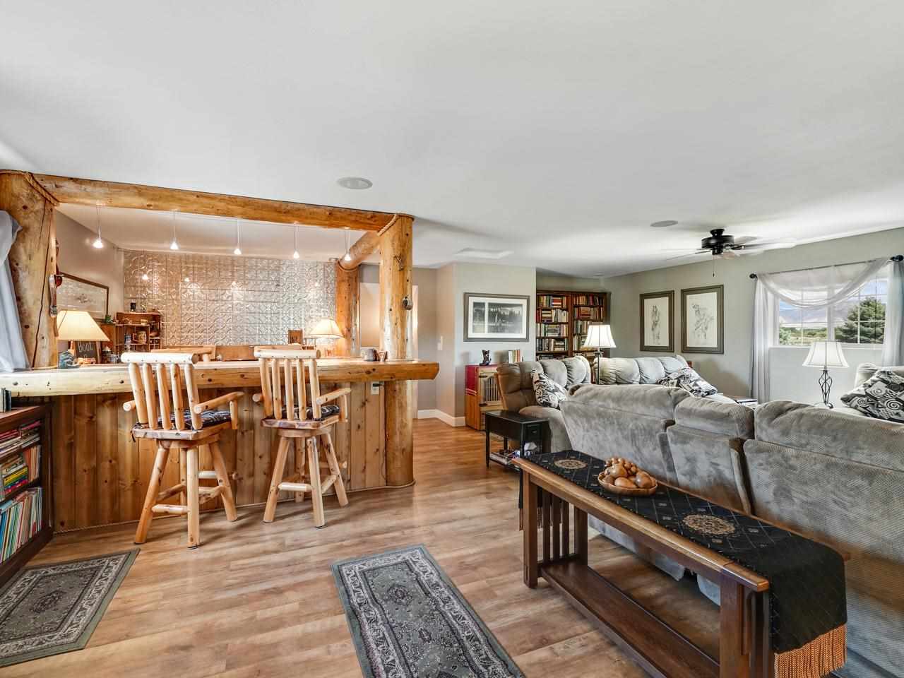 1110 22 Road Grand Junction, CO 81505 - Photo 15 of 42 a living room with lots of furniture and a large window