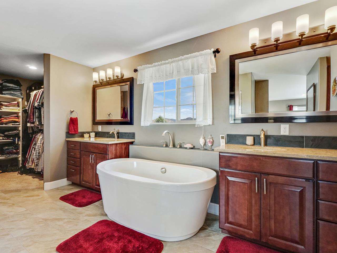 1110 22 Road Grand Junction, CO 81505 - Photo 21 of 42 a spacious bathroom with a tub sink and mirror