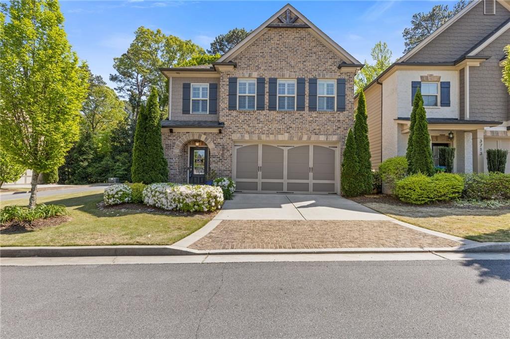3715 Lexington Road Tucker, GA 30084 - Photo 1 of 1 a front view of a house with garden