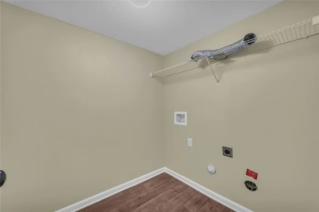 a white bath tub sitting in a bathroom next to a window