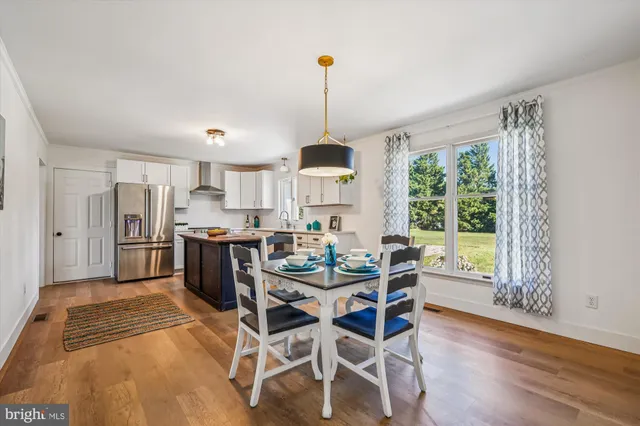 a dining room with furniture window wooden floor