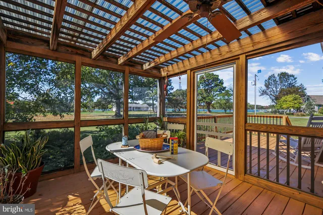 a balcony with furniture and wooden floor