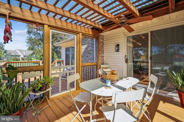 a balcony with furniture and wooden floor