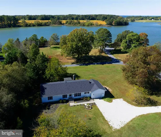 a aerial view of a house with a lake view