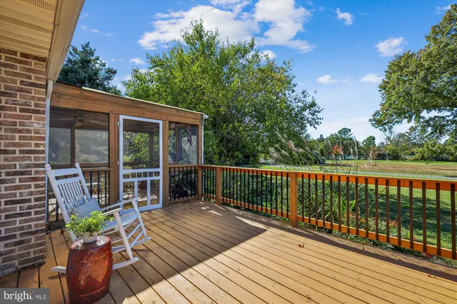 a balcony with wooden floor and wooden floor