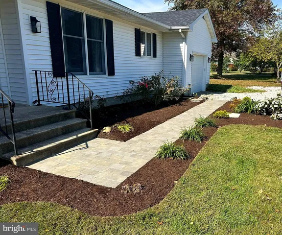 a view of a backyard with a garden