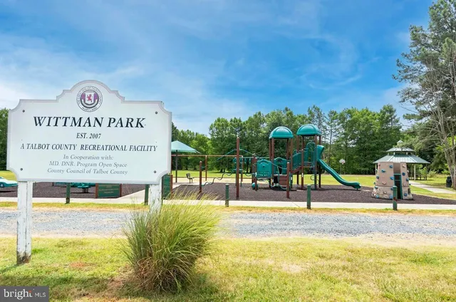 a view of a swimming pool with an outdoor seating
