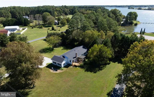 an aerial view of a house with outdoor space