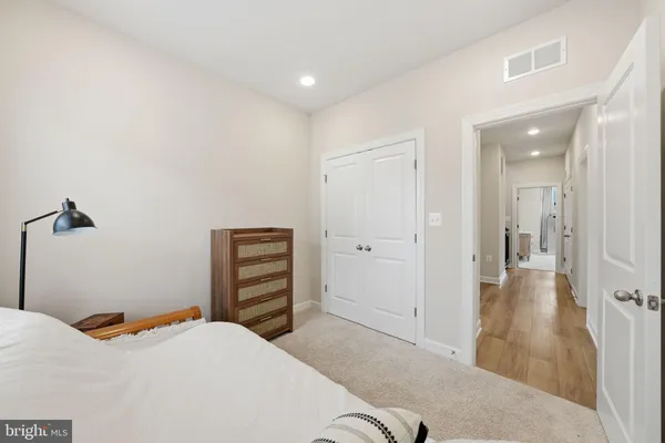 a bedroom with a bed and a bathroom