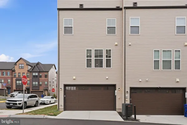 a front view of a house with a garage