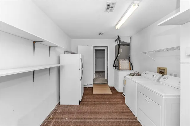a utility room with cabinets