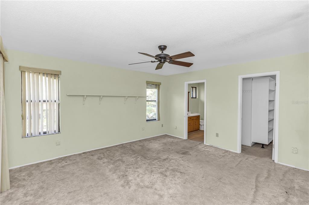 55 Crooked Pine Road Port Orange, FL 32128 - Photo 19 of 28 an empty room with closet and windows