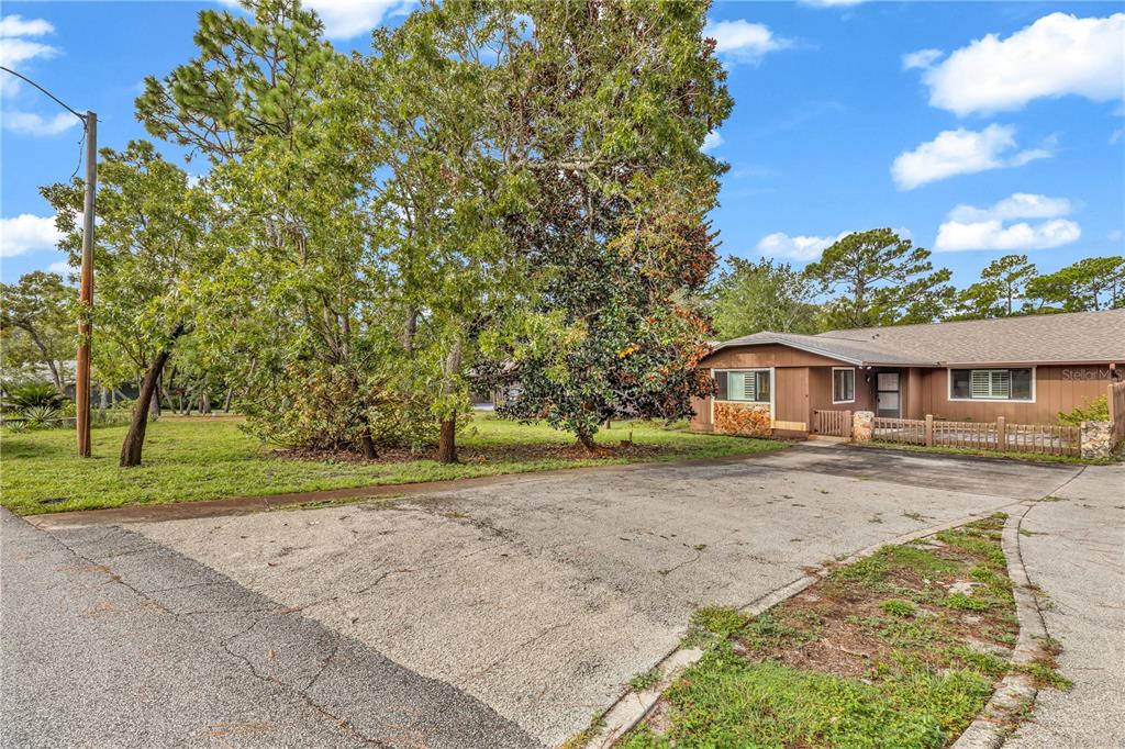 55 Crooked Pine Road Port Orange, FL 32128 - Photo 2 of 28 a view of a house with a yard