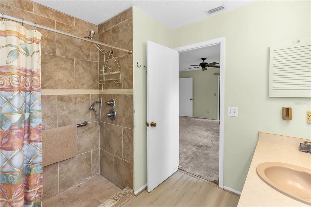 55 Crooked Pine Road Port Orange, FL 32128 - Photo 24 of 28 a bathroom with a shower and toilet