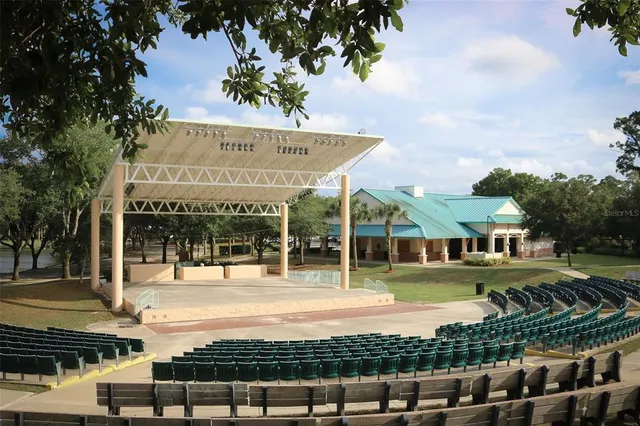 a front view of a building with a garden