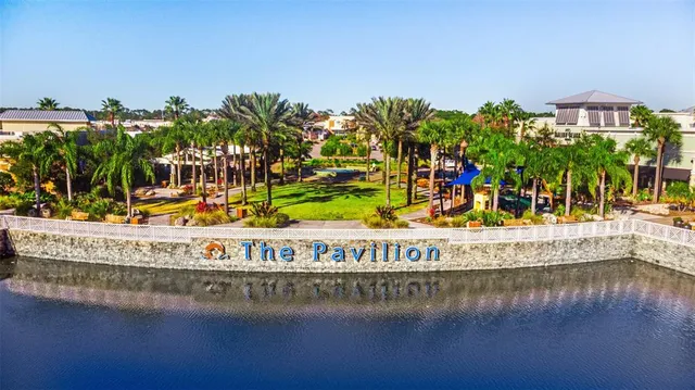 a view of a water fountain and a building in the background
