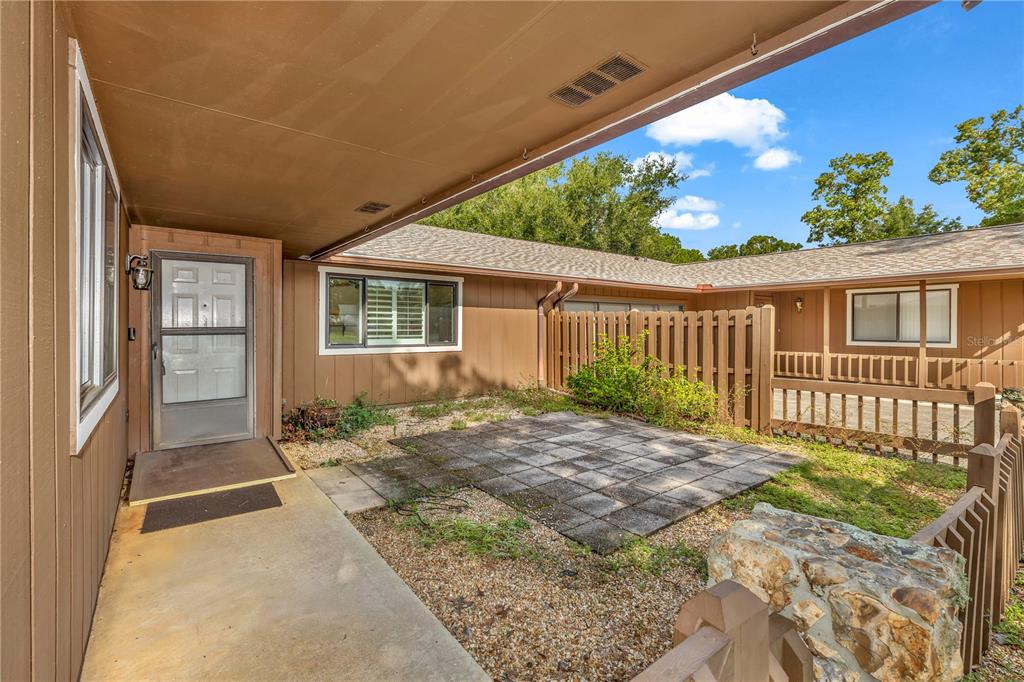 55 Crooked Pine Road Port Orange, FL 32128 - Photo 3 of 28 a view of backyard with a garden and deck