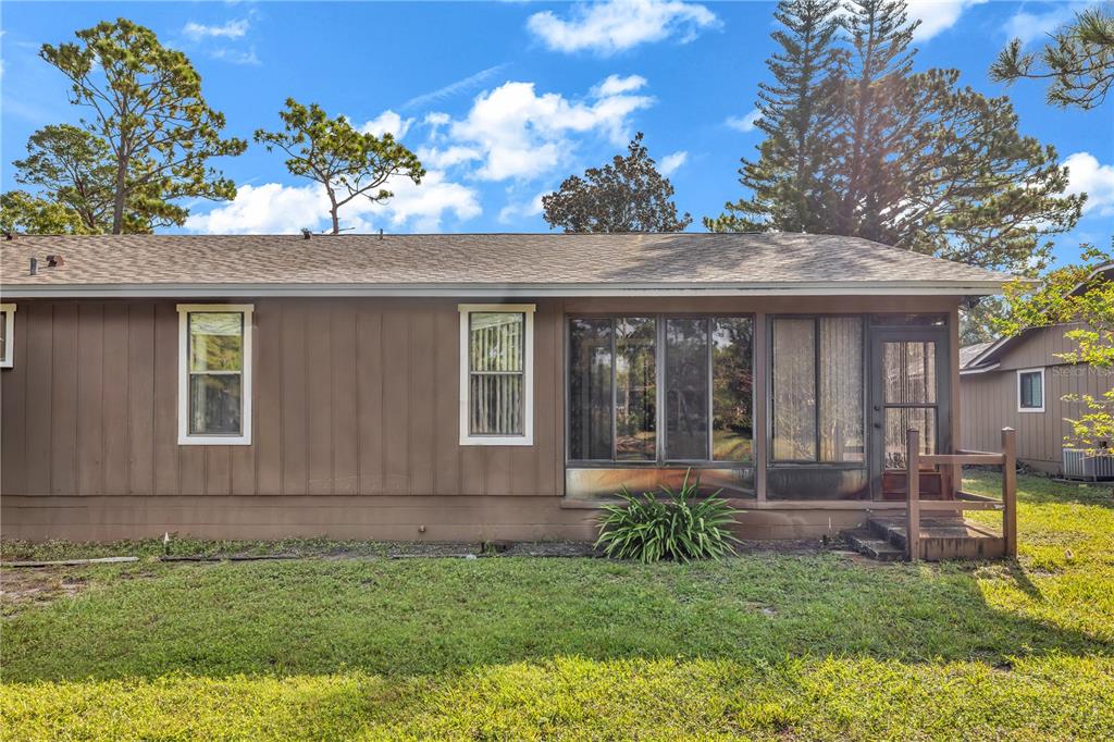 55 Crooked Pine Road Port Orange, FL 32128 - Photo 5 of 28 a front view of a house with a yard
