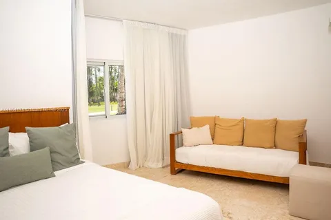 a living room with a couch and a table