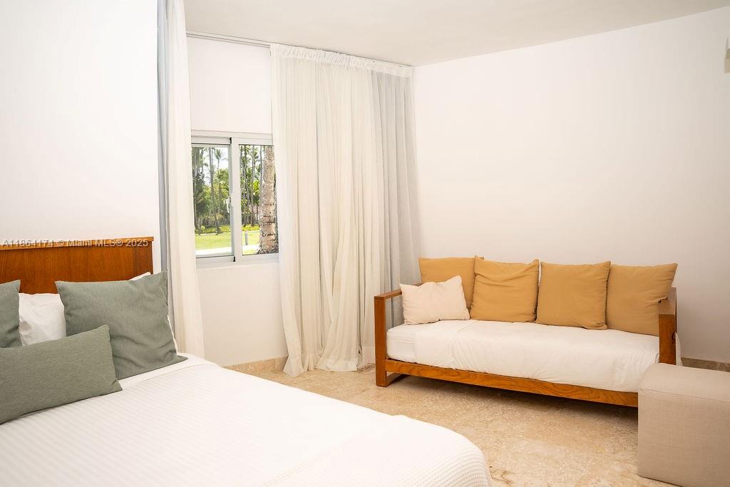 0 8c3f Q62, Unit LEVEL 1 Las Terrenas, Samaná Province 32000 - Photo 19 of 41 a living room with a couch and a table