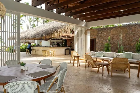 a outdoor space with lots of furniture and glass windows