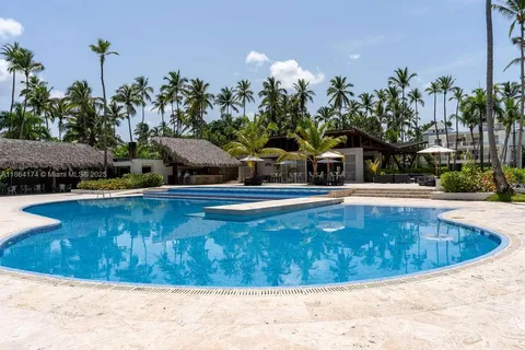 a view of a swimming pool with a yard