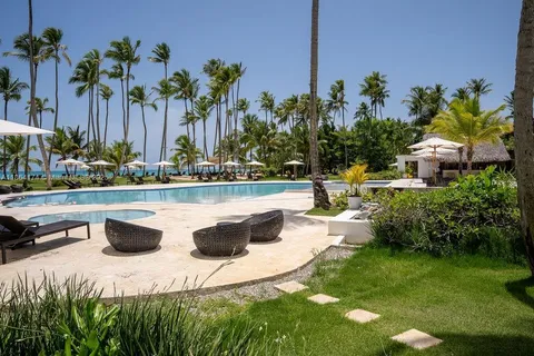 a view of a swimming pool with a yard