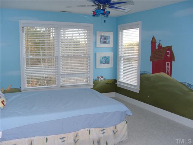 2030 Pilot-Riley Road Zebulon, NC 27597 - Photo 11 of 25 a bedroom with a bed and window