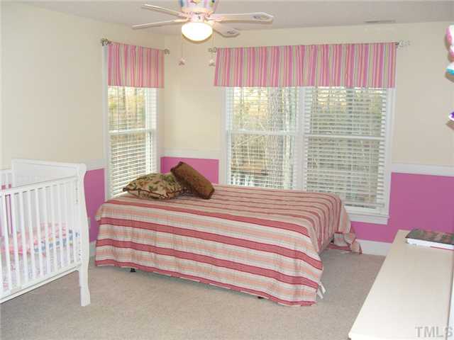 2030 Pilot-Riley Road Zebulon, NC 27597 - Photo 12 of 25 a bedroom with a bed and window