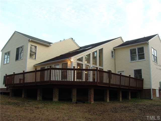 2030 Pilot-Riley Road Zebulon, NC 27597 - Photo 20 of 25 a house that has wooden fence and a tree