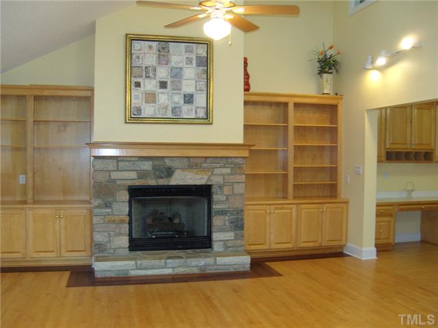 2030 Pilot-Riley Road Zebulon, NC 27597 - Photo 4 of 25 a living room with a fireplace and a cabinet