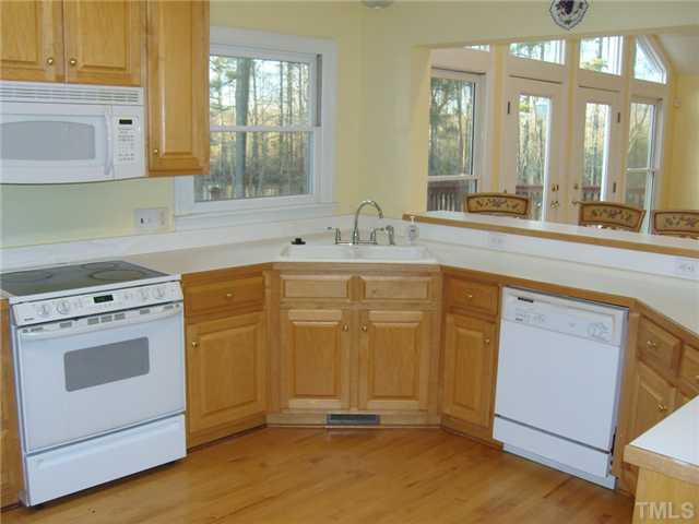 2030 Pilot-Riley Road Zebulon, NC 27597 - Photo 8 of 25 a view of a kitchen with sink and washing machine