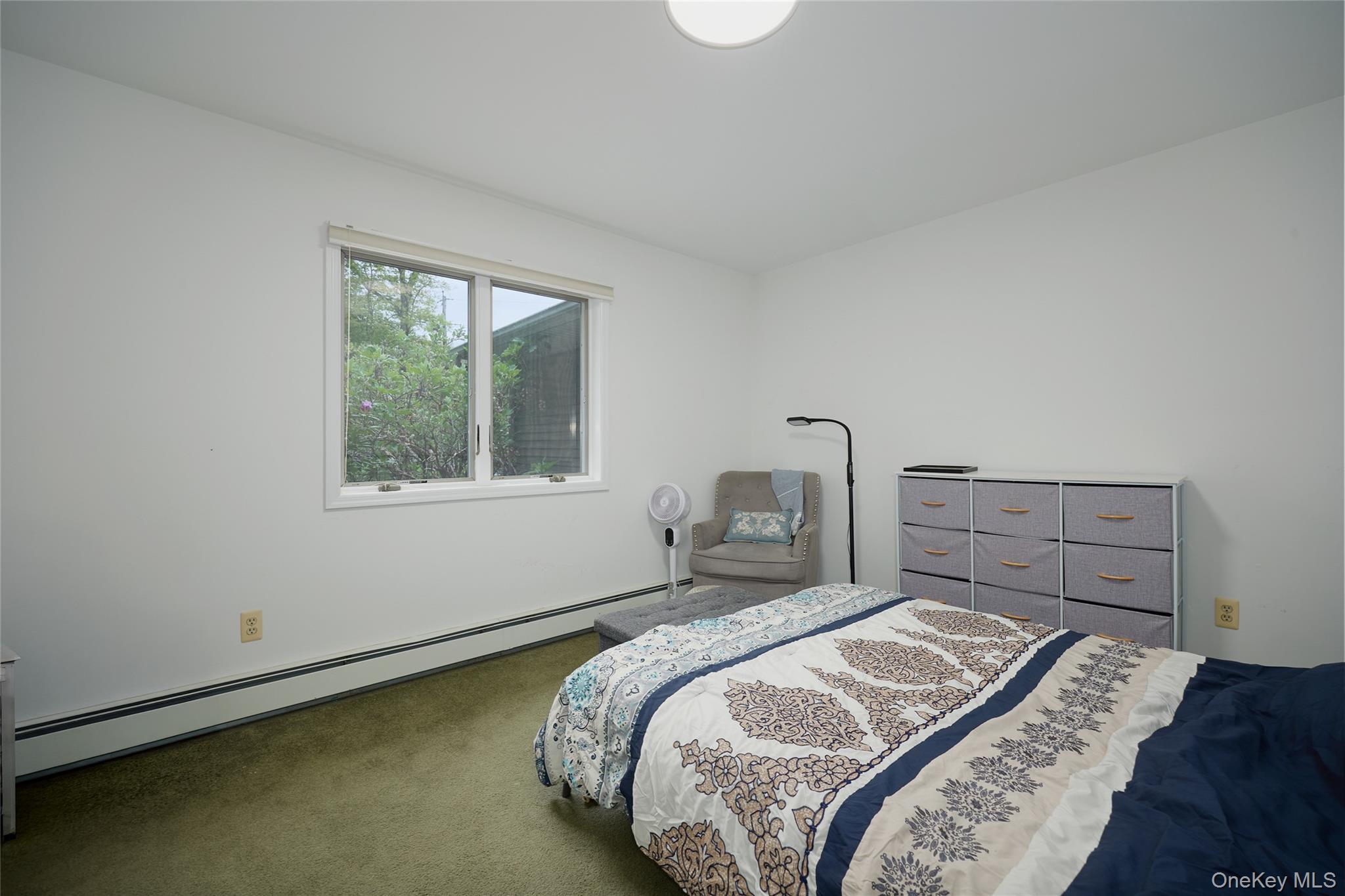 34 Maple Brook Road Tuxedo Park, NY 10987 - Photo 11 of 25 a bedroom with a bed and a window