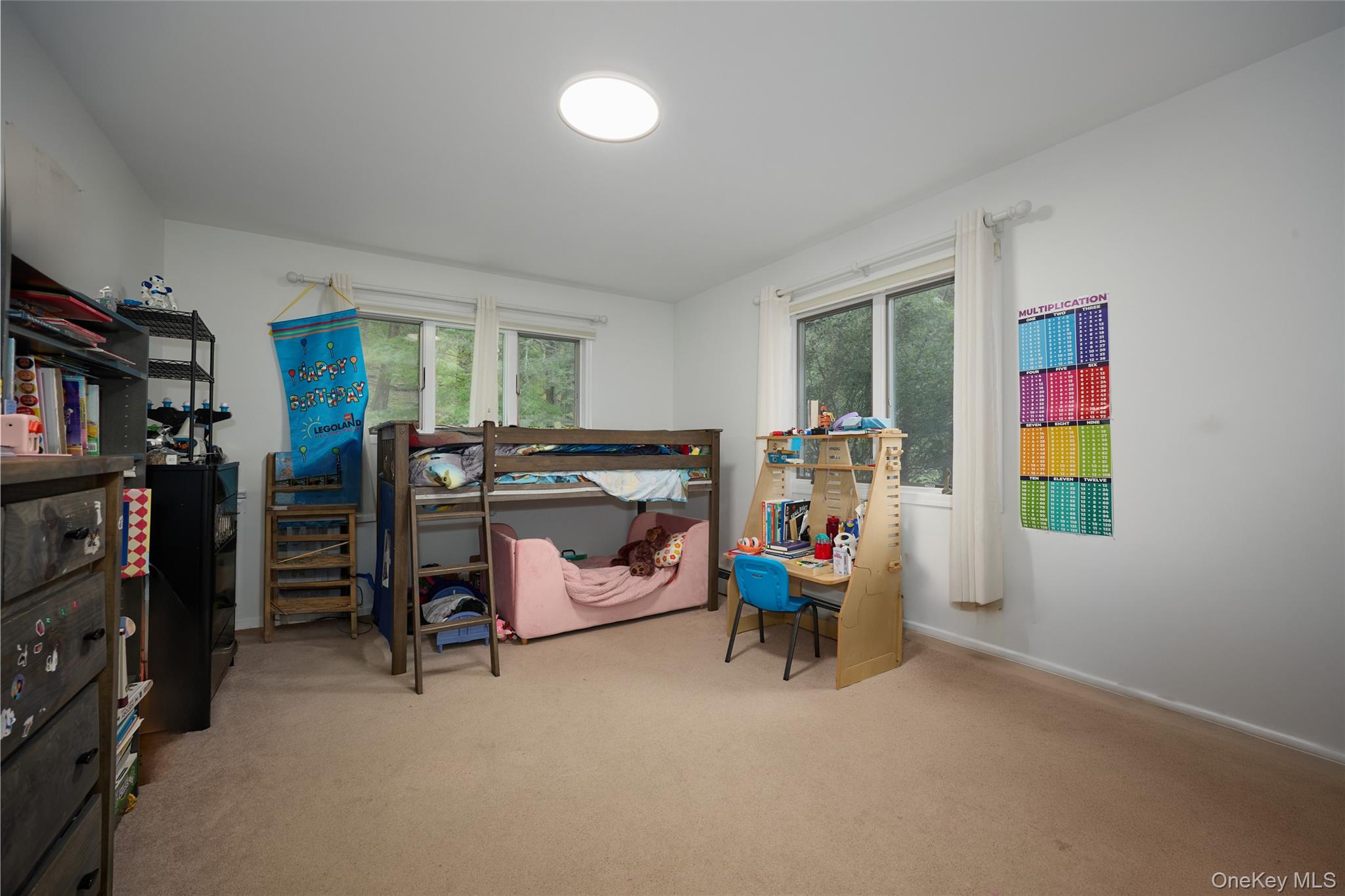 34 Maple Brook Road Tuxedo Park, NY 10987 - Photo 12 of 25 a bed room with furniture and a window