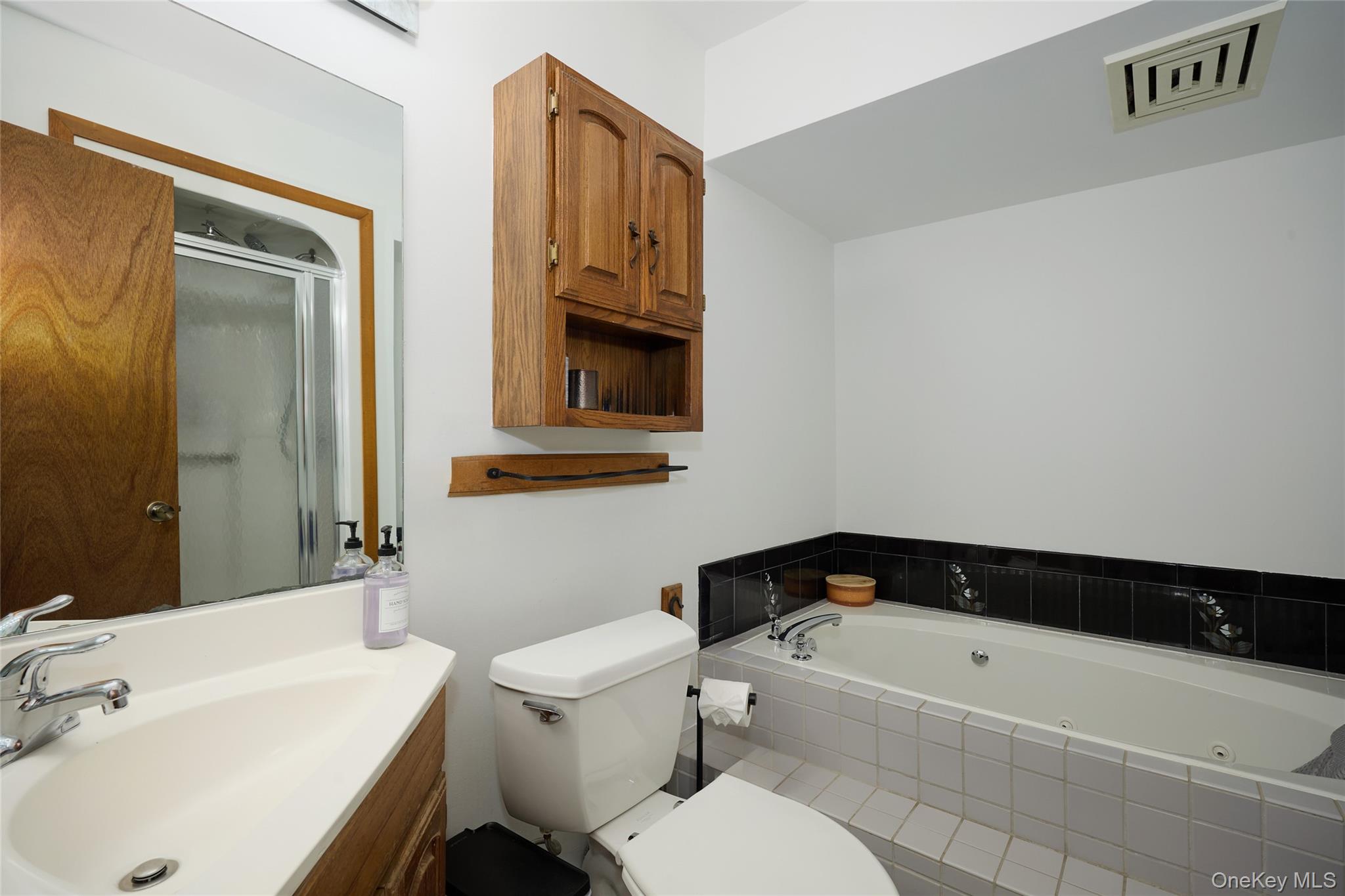 34 Maple Brook Road Tuxedo Park, NY 10987 - Photo 13 of 25 a bathroom with a sink a toilet and bathtub